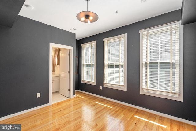 19 Yogurt Ln, Baltimore, MD 21231 - unfurnished room featuring wood finished floors, a smoke detector, and fire sprinkler in ceiling