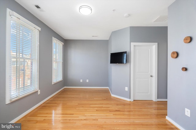 19 Yogurt Ln, Baltimore, MD 21231 - spare room with light wood-type flooring and a smoke detector