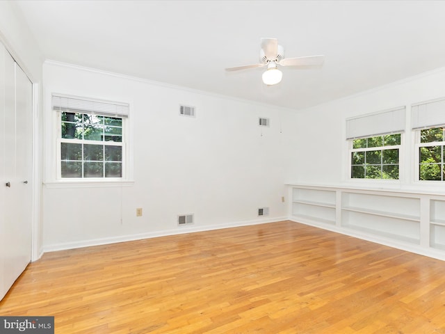 31 Cullinan Dr, Gaithersburg, MD 20878 - spare room with healthy amount of natural light, light wood finished floors, crown molding, and a ceiling fan