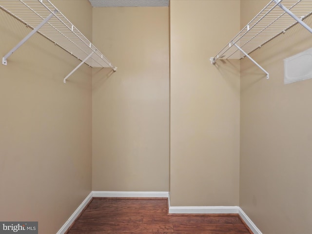 2726 Gallows Rd Unit 411, Vienna, VA 22180 - walk in closet featuring wood finished floors