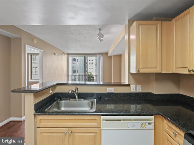 2726 Gallows Rd Unit 411, Vienna, VA 22180 - kitchen with dishwasher, light brown cabinets, dark wood-type flooring, dark stone countertops, and a textured ceiling