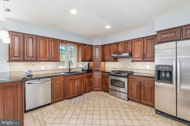 9523 Hickory Falls Way, Baltimore, MD 21236 - kitchen featuring stainless steel appliances, under cabinet range hood, backsplash, brown cabinetry, and recessed lighting
