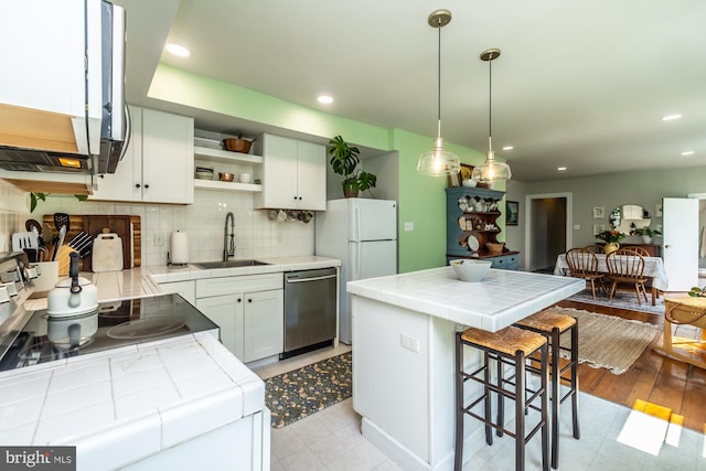 239 W Barnard St, West Chester, PA 19382 - kitchen featuring dishwasher, tile counters, open shelves, a kitchen island, and tasteful backsplash
