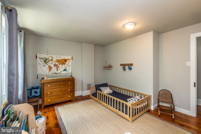 239 W Barnard St, West Chester, PA 19382 - bedroom with hardwood / wood-style floors and a nursery area