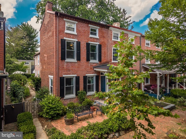 239 W Barnard St, West Chester, PA 19382 - view of front of house with a chimney and brick siding