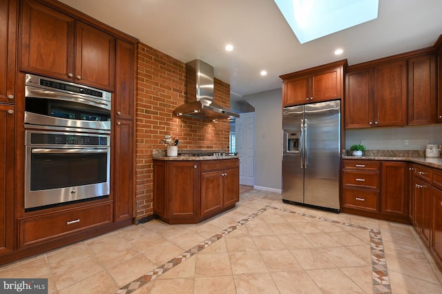 10 Sonora Dr, Pasadena, MD 21122 - kitchen with appliances with stainless steel finishes, wall chimney exhaust hood, dark stone countertops, a skylight, and recessed lighting