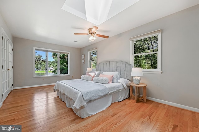 10 Sonora Dr, Pasadena, MD 21122 - bedroom with light wood-style flooring, multiple windows, and ceiling fan
