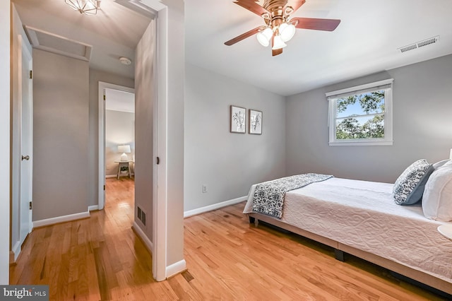 10 Sonora Dr, Pasadena, MD 21122 - bedroom with wood finished floors, attic access, and ceiling fan