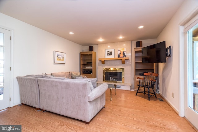 14 Winslow Way, Dresher, PA 19025 - living room with light wood-style flooring, a large fireplace, and recessed lighting