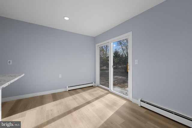 321 Curacao St, Toms River, NJ 08757 - spare room featuring a baseboard heating unit, wood finished floors, and recessed lighting