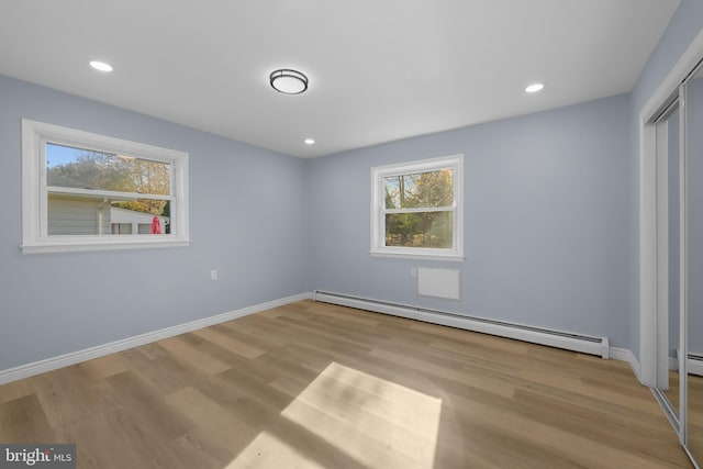 321 Curacao St, Toms River, NJ 08757 - unfurnished bedroom featuring a baseboard radiator, wood finished floors, a closet, and recessed lighting