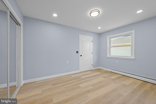 321 Curacao St, Toms River, NJ 08757 - unfurnished bedroom featuring light wood-style floors, a closet, baseboard heating, and recessed lighting