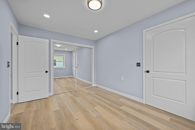 321 Curacao St, Toms River, NJ 08757 - unfurnished bedroom with light wood finished floors, a closet, baseboard heating, and recessed lighting