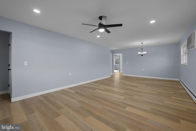 321 Curacao St, Toms River, NJ 08757 - spare room with a chandelier, a ceiling fan, light wood-style floors, recessed lighting, and a baseboard heating unit