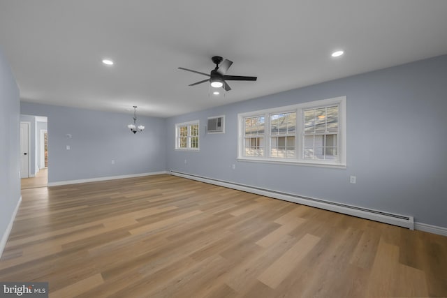 321 Curacao St, Toms River, NJ 08757 - spare room with a baseboard radiator, a chandelier, ceiling fan, light wood-style floors, and recessed lighting