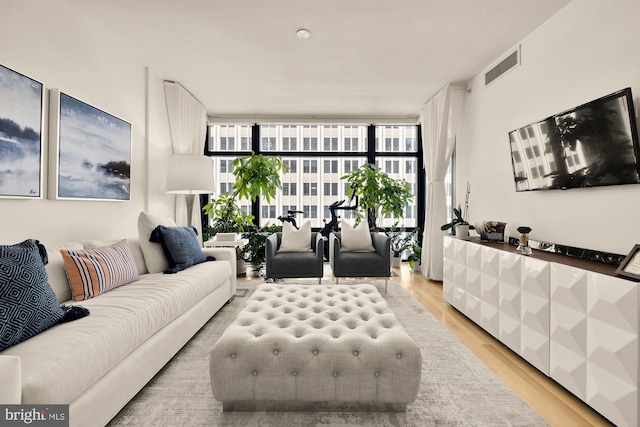 1010 Massachusetts Ave NW Unit 706, Washington, DC 20001 - living area with expansive windows and light wood finished floors