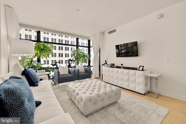 1010 Massachusetts Ave NW Unit 706, Washington, DC 20001 - living area with wood finished floors and floor to ceiling windows