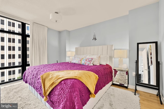 1010 Massachusetts Ave NW Unit 706, Washington, DC 20001 - bedroom with wood finished floors and baseboards