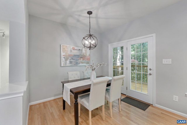 834 Rock Creek Rd, Charlottesville, VA 22903 - dining area with light wood finished floors and a chandelier