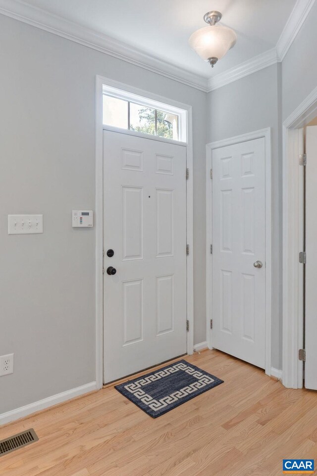 834 Rock Creek Rd, Charlottesville, VA 22903 - entryway with crown molding and light wood-style floors