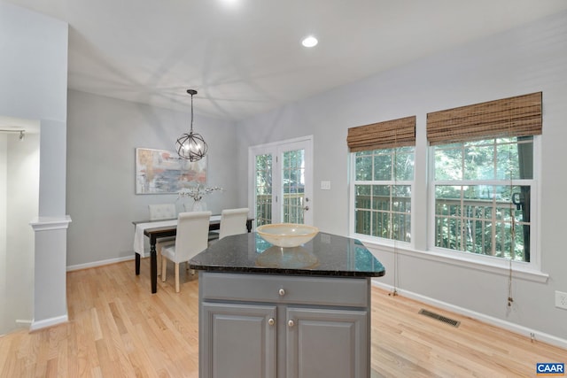 834 Rock Creek Rd, Charlottesville, VA 22903 - kitchen featuring light wood finished floors, a center island, healthy amount of natural light, decorative light fixtures, and recessed lighting