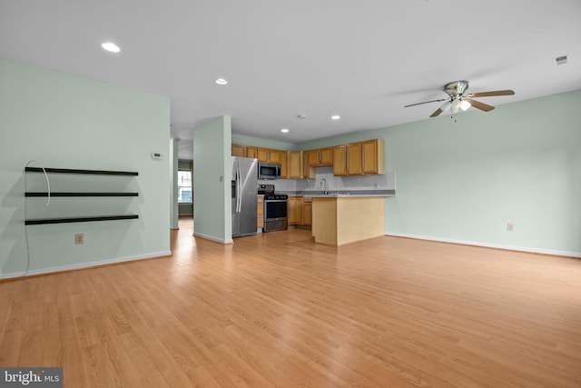 723 Dell Ct, Southampton, PA 18966 - unfurnished living room with light wood-type flooring, a ceiling fan, and recessed lighting