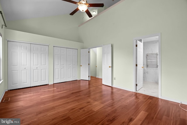 723 Dell Ct, Southampton, PA 18966 - unfurnished bedroom with high vaulted ceiling, wood finished floors, multiple closets, ensuite bathroom, and a ceiling fan