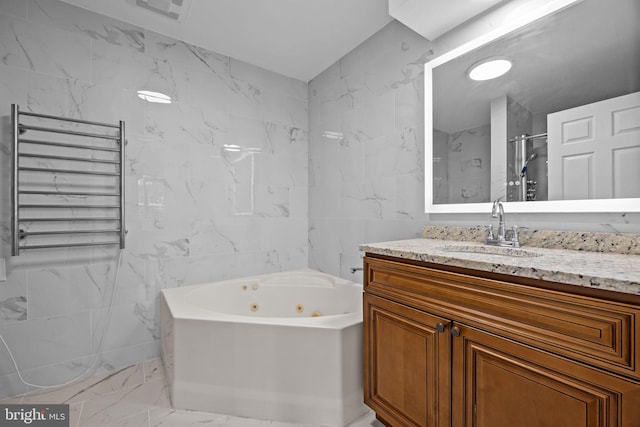 723 Dell Ct, Southampton, PA 18966 - full bath with radiator, marble finish flooring, tile walls, a whirlpool tub, and vanity
