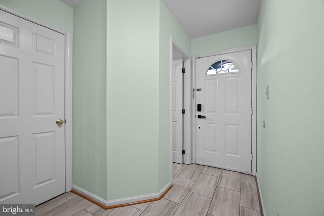 723 Dell Ct, Southampton, PA 18966 - foyer entrance with wood tiled floors and baseboards