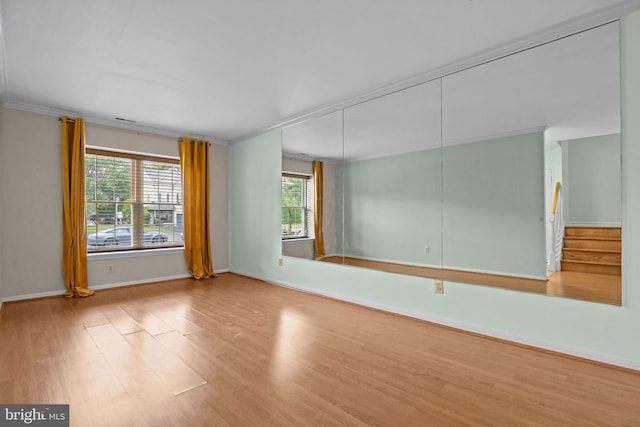 723 Dell Ct, Southampton, PA 18966 - empty room with wood finished floors, ornamental molding, and stairway