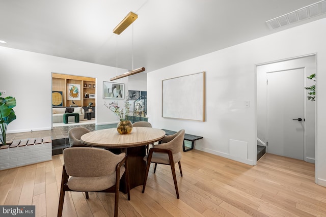 2103 Northcliff Dr, Baltimore, MD 21209 - dining area with light wood-style floors and stairs