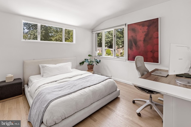2103 Northcliff Dr, Baltimore, MD 21209 - bedroom featuring lofted ceiling, a desk, wood finished floors, and multiple windows