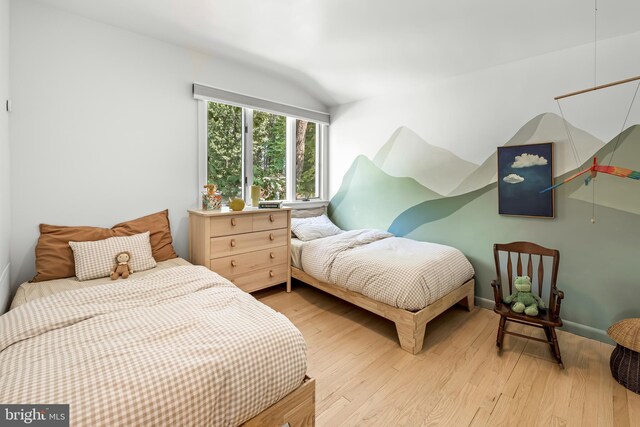 2103 Northcliff Dr, Baltimore, MD 21209 - bedroom featuring lofted ceiling and light wood-type flooring