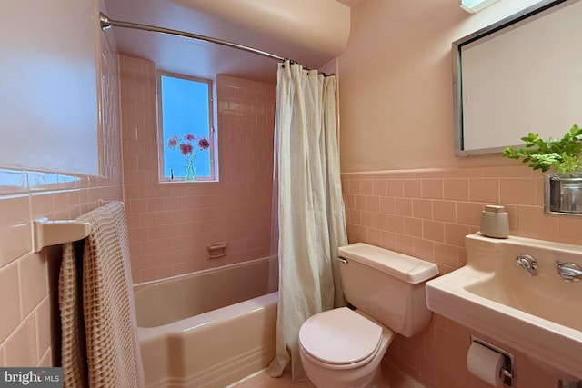 2103 Northcliff Dr, Baltimore, MD 21209 - bathroom featuring tile walls, shower / tub combo with curtain, and a wainscoted wall