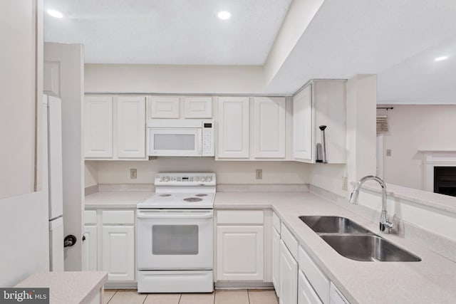 1541 Lincoln Way Unit 201A, Mclean, VA 22102 - kitchen with white appliances, white cabinets, light countertops, recessed lighting, and light tile patterned flooring