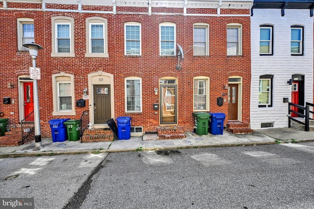 115 N Bradford St, Baltimore, MD 21224 - view of property featuring brick siding and entry steps