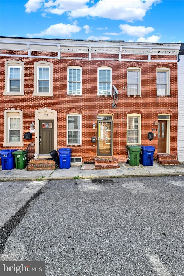 115 N Bradford St, Baltimore, MD 21224 - townhome / multi-family property with brick siding and entry steps