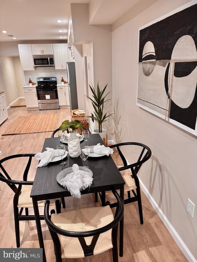 1182 Washington Blvd, Baltimore, MD 21230 - dining area featuring light wood-style floors and recessed lighting