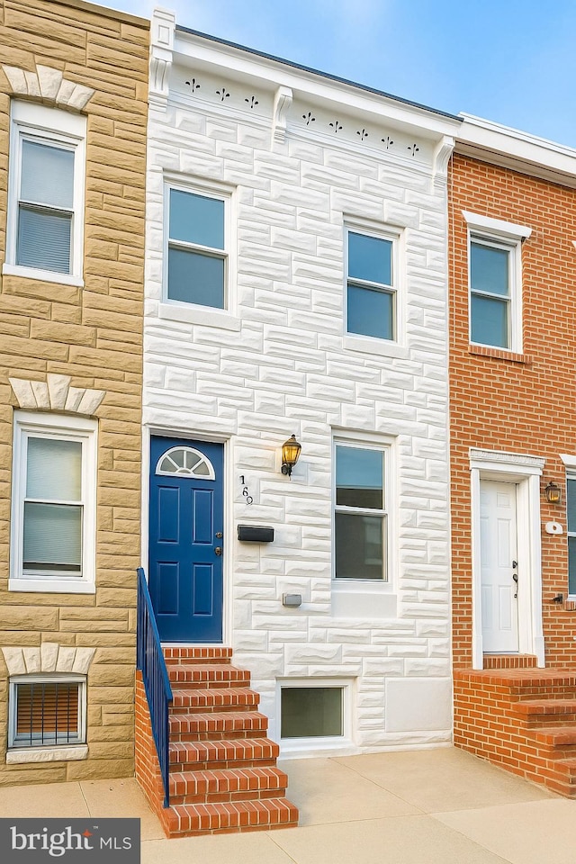 1182 Washington Blvd, Baltimore, MD 21230 - townhome / multi-family property featuring entry steps and stone siding