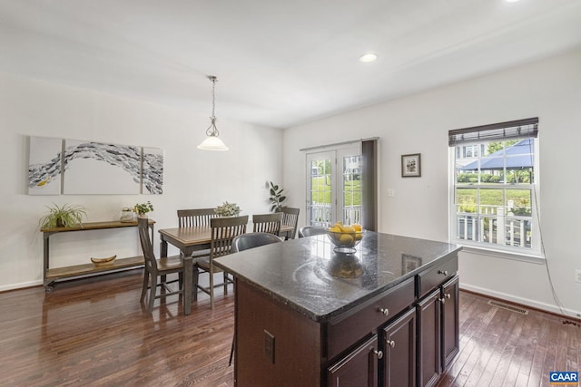 2159 Whispering Hollow Ln, Charlottesville, VA 22911 - kitchen featuring plenty of natural light, dark wood finished floors, dark brown cabinetry, recessed lighting, and dark stone counters