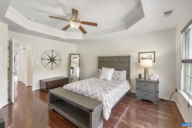 2159 Whispering Hollow Ln, Charlottesville, VA 22911 - bedroom featuring a raised ceiling, dark wood finished floors, crown molding, and ceiling fan