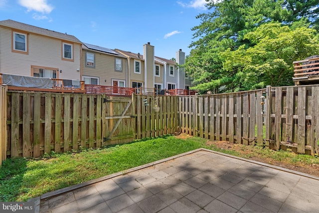 19232 Wheatfield Ter, Gaithersburg, MD 20879 - fenced backyard featuring a gate, a residential view, and a patio