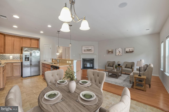 458 Exchange Ave Unit 458, Gaithersburg, MD 20878 - dining room with recessed lighting, a glass covered fireplace, and light tile patterned flooring