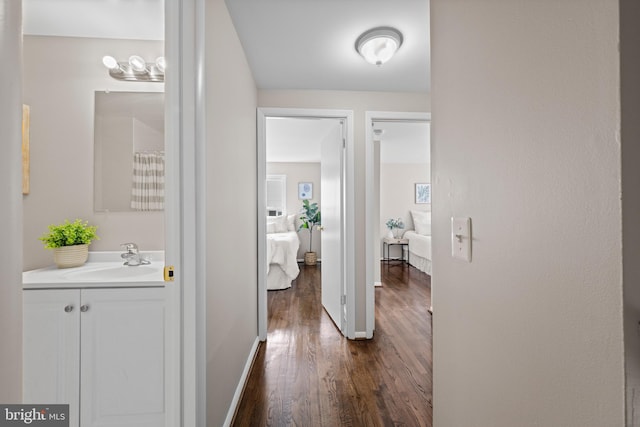 42 Brookshire Dr Unit A, Reisterstown, MD 21136 - corridor with a sink and dark wood-style floors