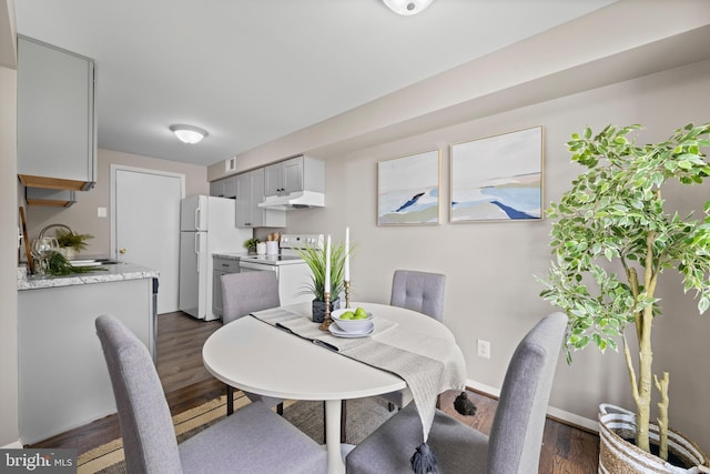 42 Brookshire Dr Unit A, Reisterstown, MD 21136 - dining space featuring dark wood-style flooring and baseboards