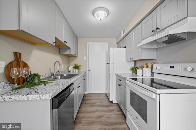42 Brookshire Dr Unit A, Reisterstown, MD 21136 - kitchen with white range with electric cooktop, dishwasher, under cabinet range hood, and wood finished floors