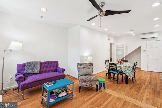 932 Locust St, Philadelphia, PA 19107 - living area featuring a wall mounted AC, light wood-type flooring, a ceiling fan, and recessed lighting