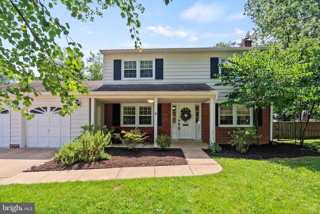 8700 Bluedale St, Alexandria, VA 22308 - traditional home with an attached garage, brick siding, driveway, and a porch
