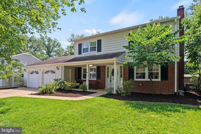 8700 Bluedale St, Alexandria, VA 22308 - traditional home featuring an attached garage, concrete driveway, brick siding, and a front lawn