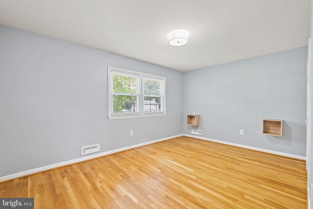 8700 Bluedale St, Alexandria, VA 22308 - spare room featuring wood finished floors and baseboards